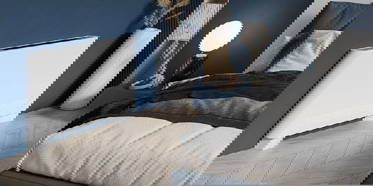 Contemporary bedroom with a white fan convector radiator against a blue accent wall.