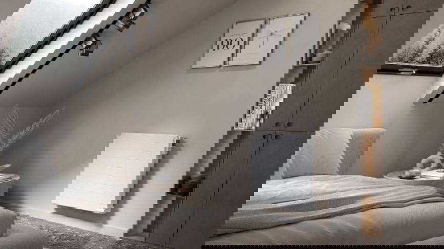 A zoned heating approach, especially in buildings with a low heat demand at peak times, can easily be put into practice by combining electric radiators with modern or even smart heating controls.